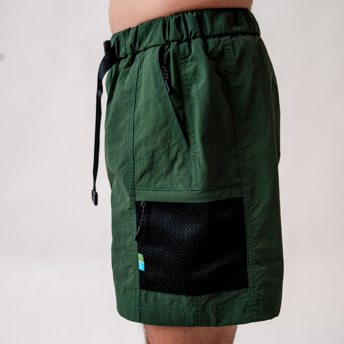 Two side pockets, two zip pockets with pull tags, one back pocket